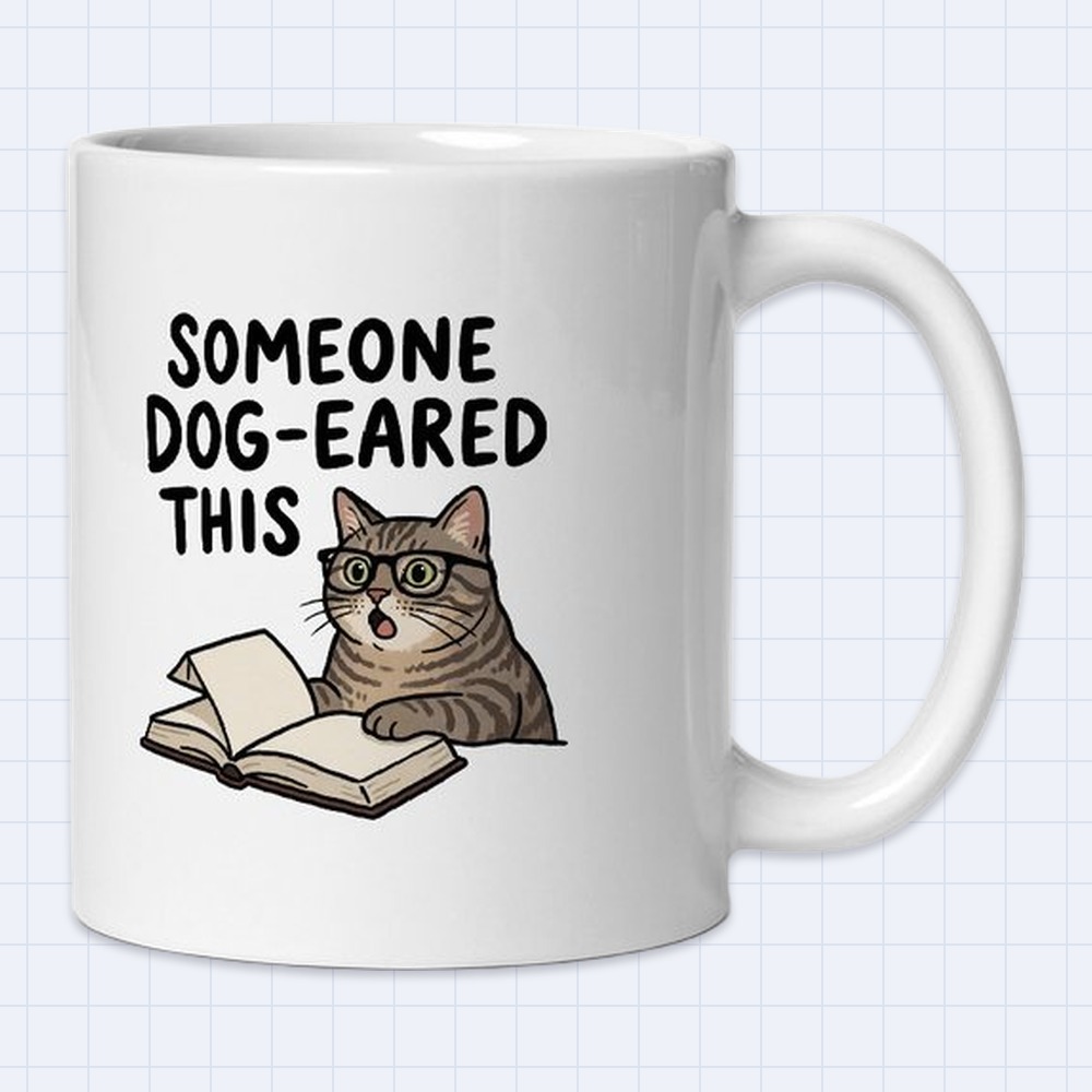 Book Lover Cat in Glasses Mug – "Someone dog-eared this" | 11 oz White Ceramic Coffee Mug