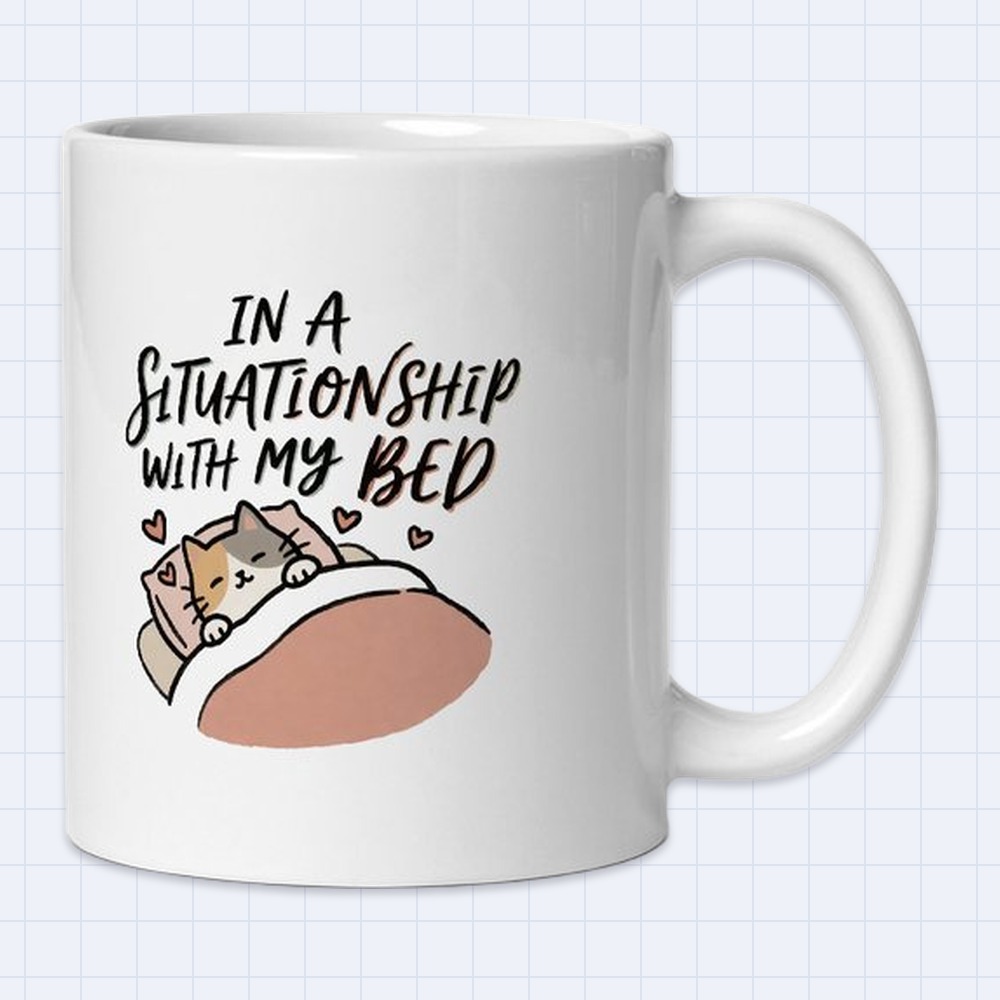 Cute Sleepy Cat in Bed Mug – "In a situationship with my bed" | 11 oz White Ceramic Coffee Mug